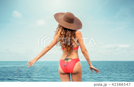 Happy young woman at beach in summer vacation. Happy young woman at beach in summer vacation. 42366547
