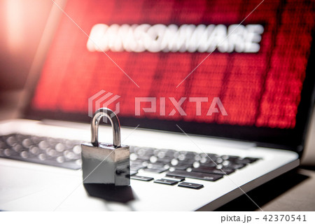 Padlock on laptop with ransomware attack screen 42370541