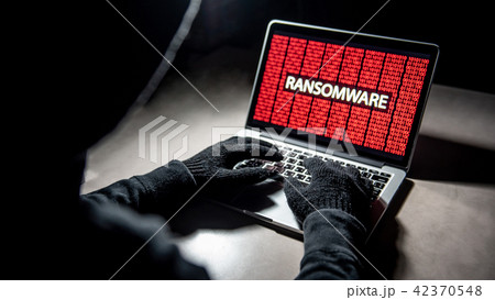 Hacker hand on laptop, ransomware attack screen 42370548