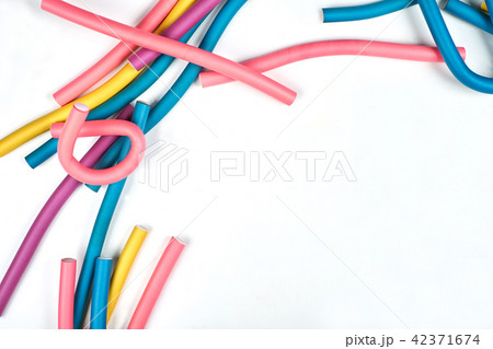 Color hair curlers on a white background with copy space Color hair curlers on a white background with copy space 42371674