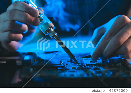 computer engineer developer soldering motherboard computer engineer developer soldering motherboard 42372009