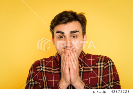 amazed shocked gobsmacked man cover mouth emotion amazed shocked gobsmacked man cover mouth emotion 42372223