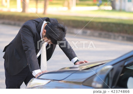 Businessman feel headache near his broken down car 42374866