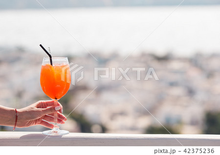 Closeup glass with alcohol drink background in beautiful old Mykonos 42375236