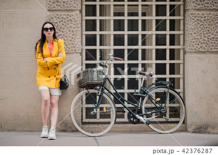 Woman walking in city. Young attractive tourist outdoors in italian city Woman walking in city. Young attractive tourist outdoors in italian city 42376287