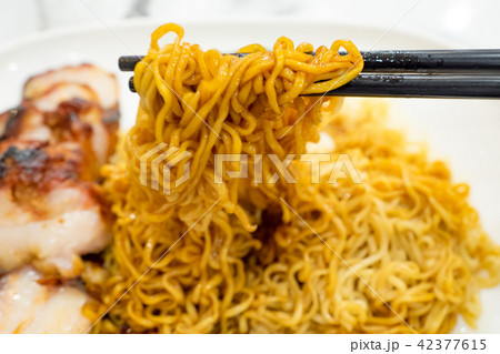 Egg noodle with roasted red pork 42377615