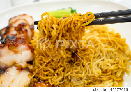 Egg noodle with roasted red pork 42377616