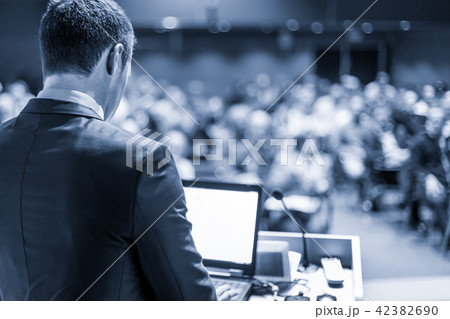 Public speaker giving talk at business event. 42382690