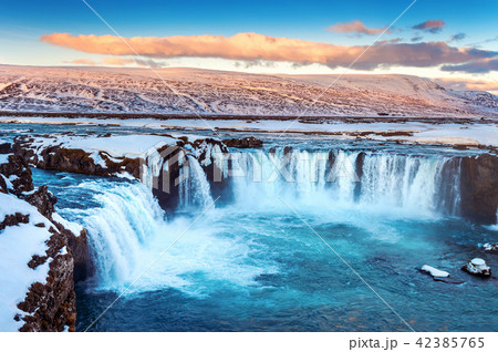 Godafoss waterfall at sunset in winter, Iceland. Godafoss waterfall at sunset in winter, Iceland. 42385765