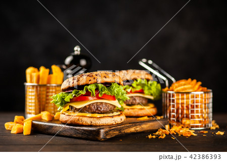 Delicious grilled burgers Delicious grilled burgers 42386393