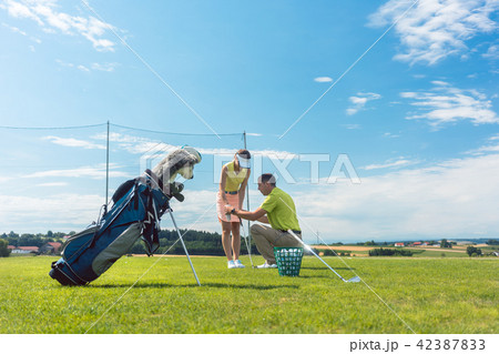 Full length of an experienced instructor teaching a young woman  42387833