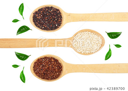 Black red white quinoa seeds in wooden spoon decorated with green leaves isolated on white Black red white quinoa seeds in wooden spoon decorated with green leaves isolated on white 42389700