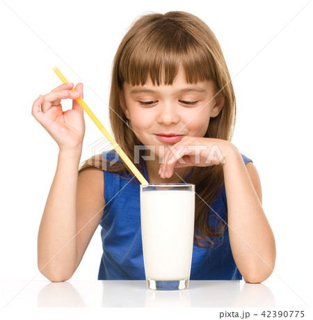 Cute little girl with a glass of milk Cute little girl with a glass of milk 42390775
