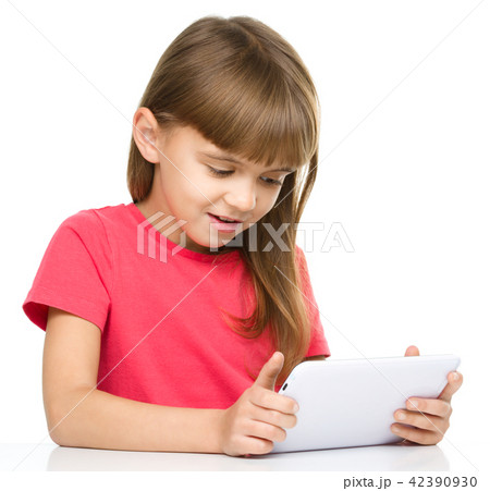 Young girl is using tablet Young girl is using tablet 42390930