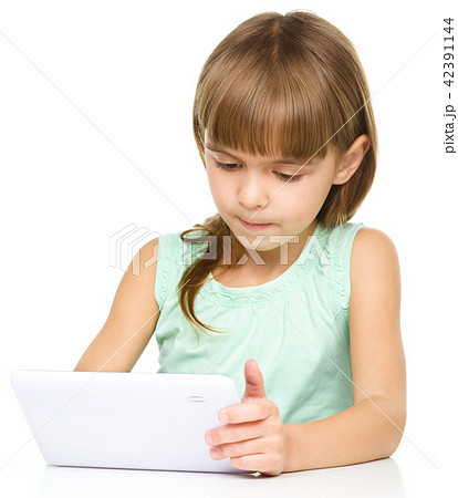 Young girl is using tablet Young girl is using tablet 42391144