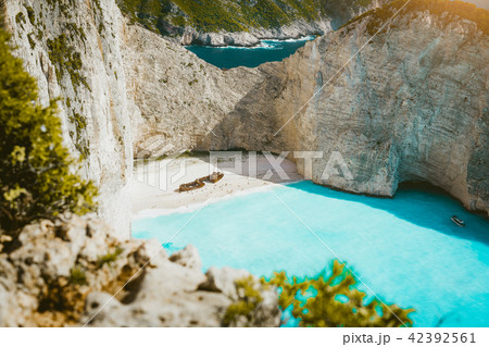 Navagio beach with shipwreck on sandy beach and turquoise blue sea water surrounded by huge white 42392561