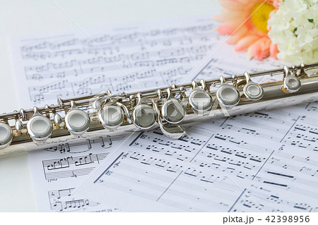 Sheet Music On White Background And Photo Of Flute Stock Photo