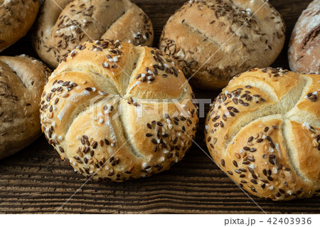 Different bread on a rustic wooden background. Different bread on a rustic wooden background. 42403936