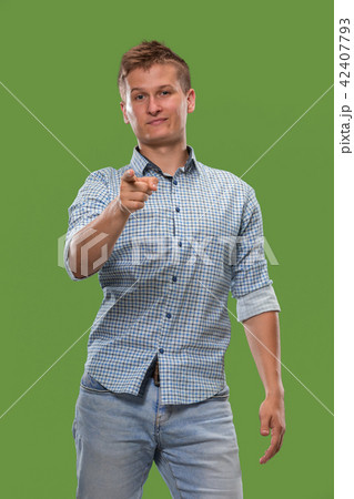 The overbearing businessman point you and want you, half length closeup portrait on green background 42407793