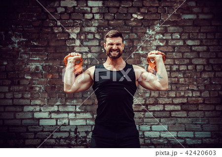 Athletic man working out with a kettlebell. Strength and motivation 42420603