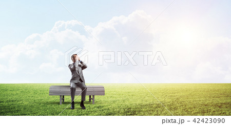 Young man in summer park on bench do not want to see anything 42423090