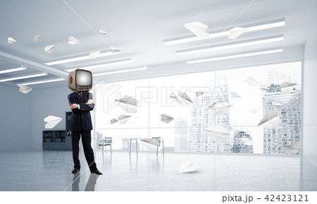 Businessman with an old TV instead of head. 42423121