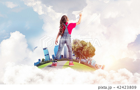 Concept of careless happy childhood with girl dreaming about fut Concept of careless happy childhood with girl dreaming about fut 42423809