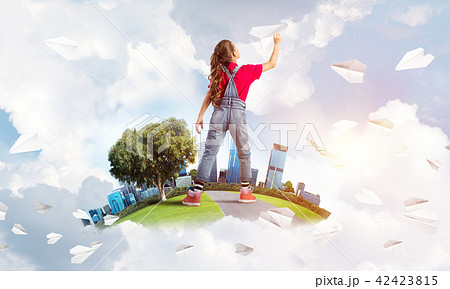 Concept of careless happy childhood with girl dreaming about future 42423815