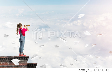 Concept of careless happy childhood with girl exploring this world Concept of careless happy childhood with girl exploring this world 42424912