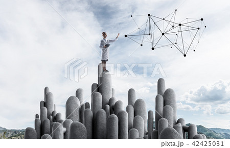 Medicine specialist or practitioner outdoors standing on top Medicine specialist or practitioner outdoors standing on top 42425031