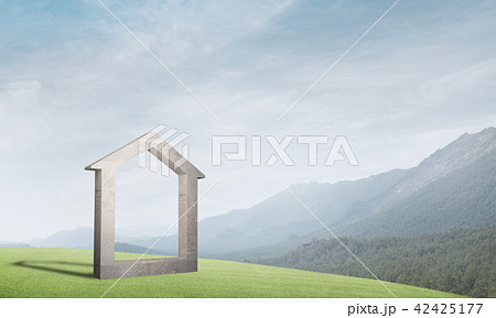 Conceptual image of concrete home sign on hill and natural landscape at background 42425177