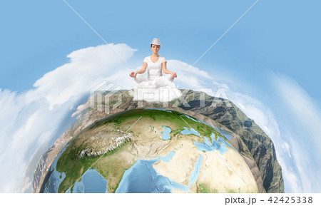 Young woman keeping mind conscious. Young woman keeping mind conscious. 42425338