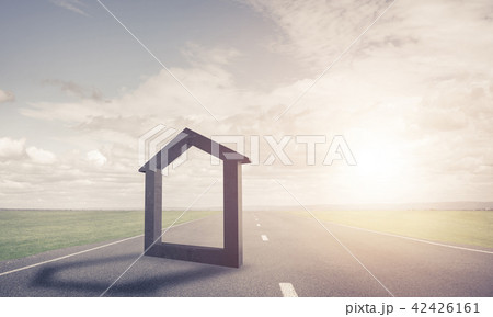 Conceptual background image of concrete home sign on asphalt road 42426161