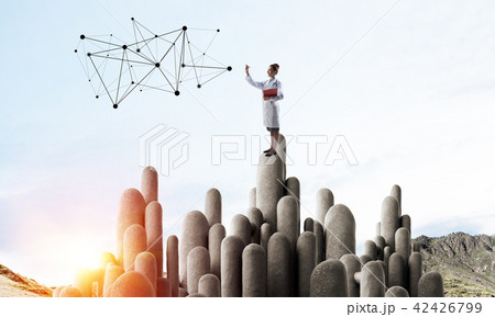 Medicine specialist or practitioner outdoors standing on top 42426799