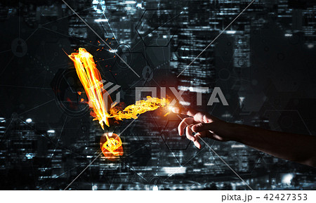 Concept of attention or punctuation with burning exclamation mark on dark background 42427353