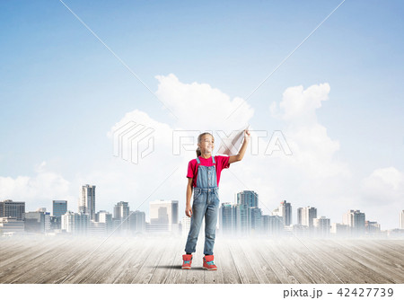 Concept of careless happy childhood with girl dreaming about future Concept of careless happy childhood with girl dreaming about future 42427739