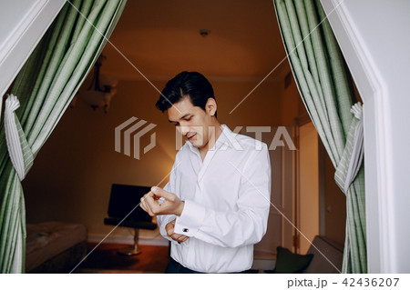 a man in a white shirt a man in a white shirt 42436207