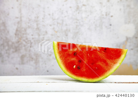 Piece  of watermelon on a wooden table 42440130