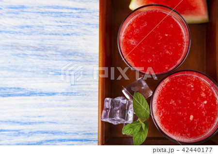 Pieces of watermelon and mint on a tray 42440177