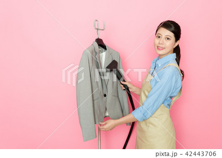 laundry woman doing the office suit ironing 42443706