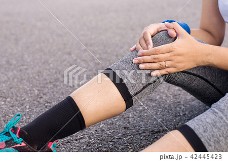 Woman suffering from pain in leg injury 42445423