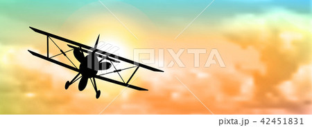 silhouette of biplane with clouds 42451831