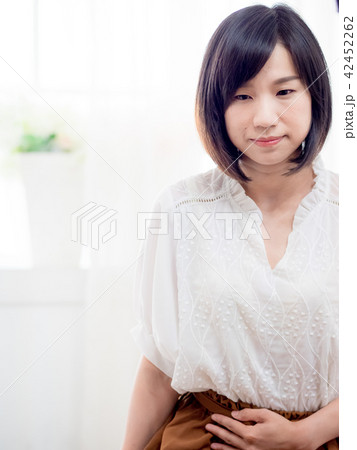 Young woman with stomachache 42452262