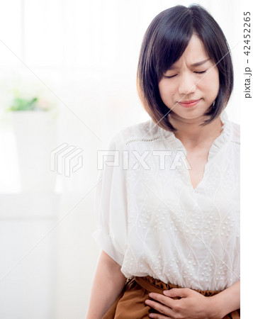 Young woman with stomachache 42452265