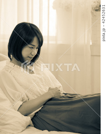 Tormented young gril in her bedroom 42452631