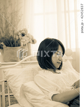 Tormented young gril in her bedroom Tormented young gril in her bedroom 42452637