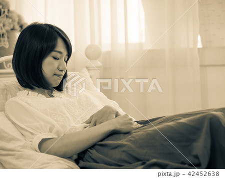 Tormented young gril in her bedroom Tormented young gril in her bedroom 42452638