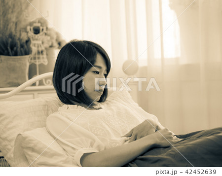 Tormented young gril in her bedroom 42452639