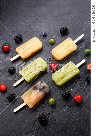 Photo of ice cream on stick, blackberry ,cherry, gooseberry 42456910