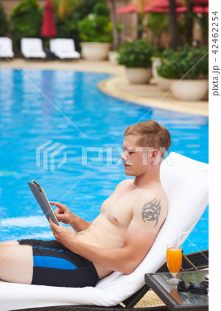 Man resting with digital tablet 42462254